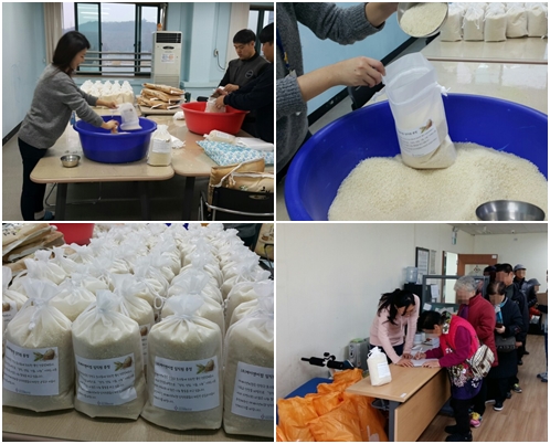 (주)제이앤씨컴에서 후원 받은 쌀을 이용자분들께 나눠드리고 있다.